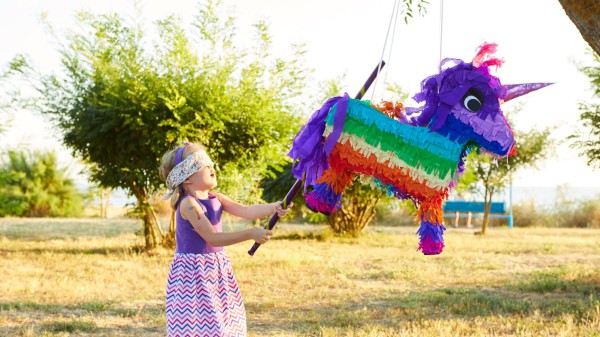 young-girl-outdoor-party-hitting-pinata-copia